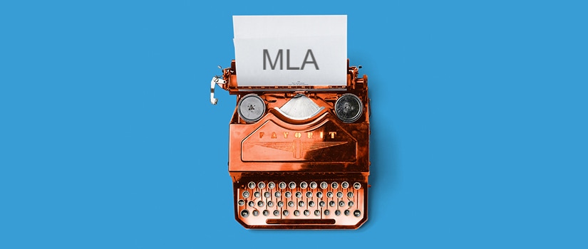 Typewriter that says "MLA"
